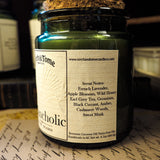 Candle jar with label on a surface with other candles in the background
