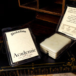 Torch & Tome Academic waxmelts in packaging on a dark surface