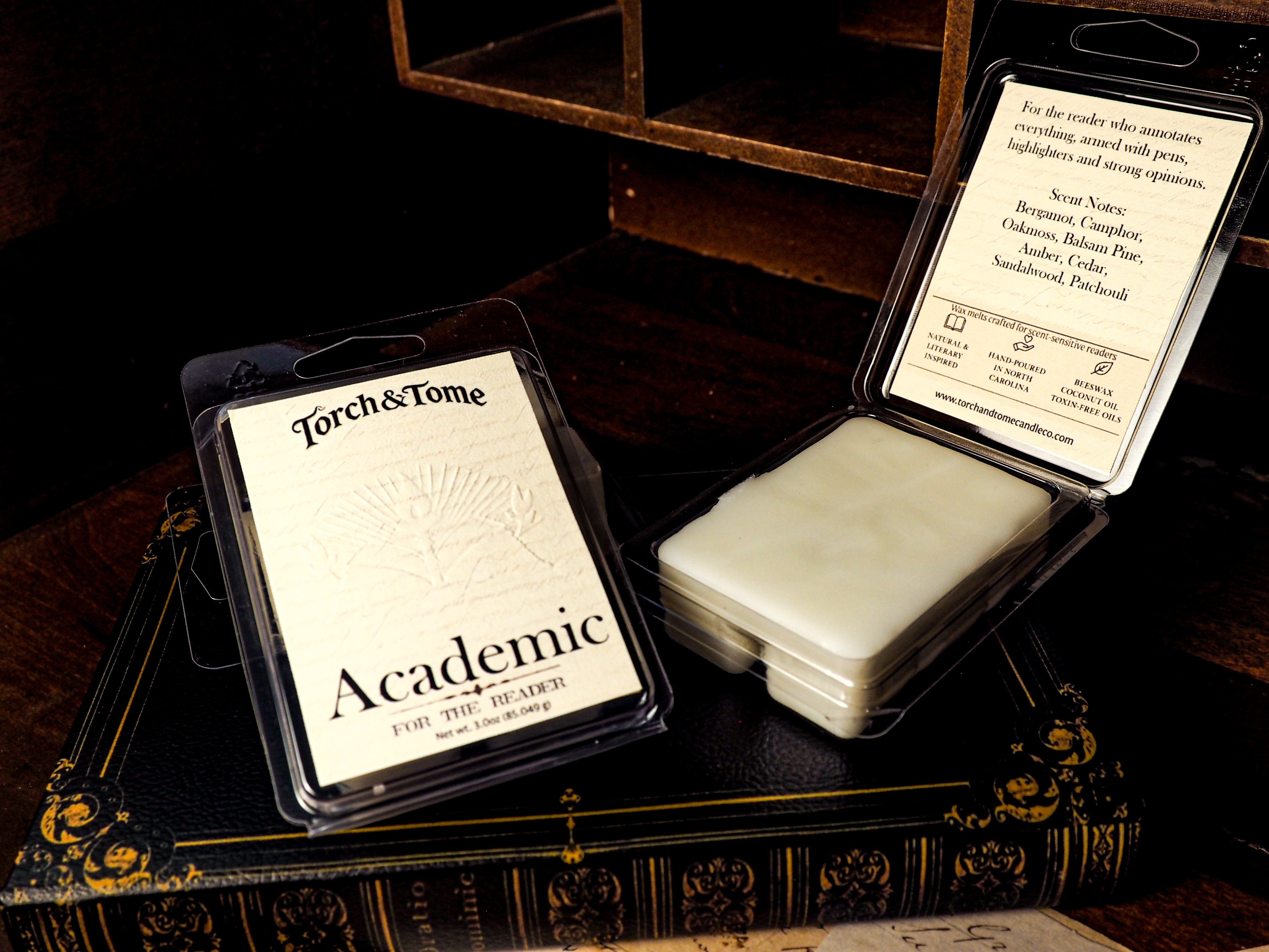 Torch & Tome Academic waxmelts in packaging on a dark surface