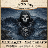 Candle label for 'Midnight Mercenary' by Torch & Tome Candle Co. with a hooded figure and skull design and two frenh swords on the label. Scent notes are obsidian, sea salt and stone.