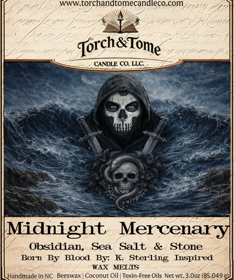 Candle label for 'Midnight Mercenary' by Torch & Tome Candle Co. with a hooded figure and skull design and two frenh swords on the label. Scent notes are obsidian, sea salt and stone.